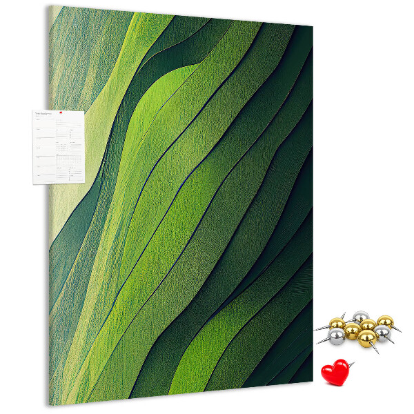 Memobord van kurk met een motief van groene bladeren in subtiele tinten