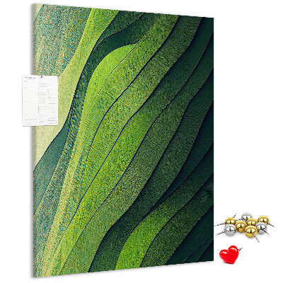 Memobord van kurk met een motief van groene bladeren in subtiele tinten