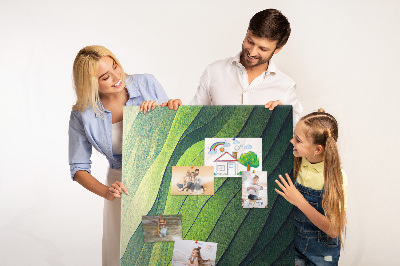 Memobord van kurk met een motief van groene bladeren in subtiele tinten
