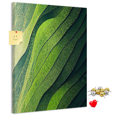 Memobord van kurk met een motief van groene bladeren in subtiele tinten