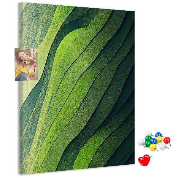 Memobord van kurk met een motief van groene bladeren in subtiele tinten