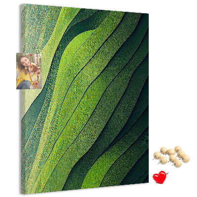 Memobord van kurk met een motief van groene bladeren in subtiele tinten