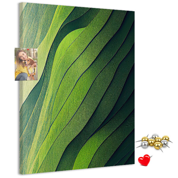 Memobord van kurk met een motief van groene bladeren in subtiele tinten