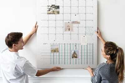 Kurken memobord met maandelijkse planning en bloemenprint