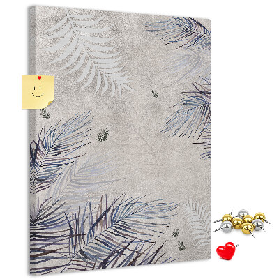 Memobord van kurk met fijne blaadjes op een grijze achtergrond