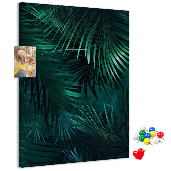Memobord van kurk met tropische bladeren in diepe groene tinten