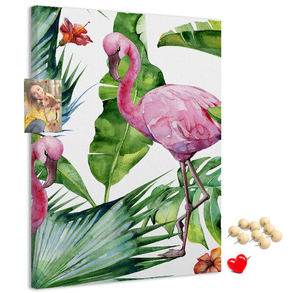 Prikbord van kurk met vrolijke flamingo's in een tropische omgeving