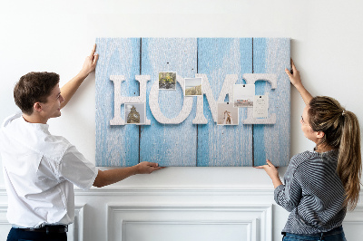 Prikbord stijlvol HOME-opschrift op een blauwe achtergrond