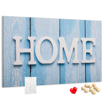 Prikbord stijlvol HOME-opschrift op een blauwe achtergrond