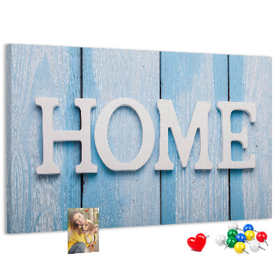 Prikbord stijlvol HOME-opschrift op een blauwe achtergrond