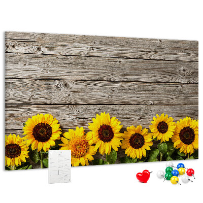 Kurkbord met een afbeelding van zonnebloemen op een achtergrond van houten planken