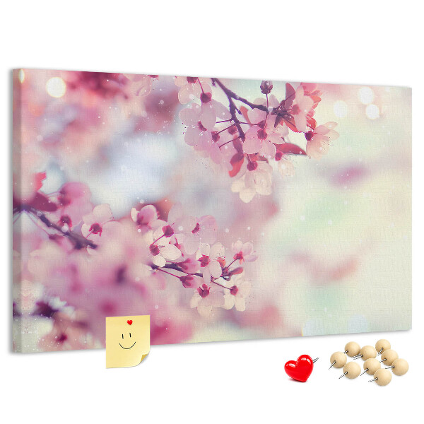 Prikbord met afbeelding van bloemtakken in pasteltinten