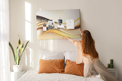 Prikbord met gouden golven op een neutrale achtergrond