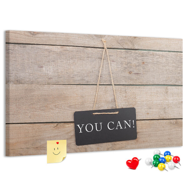 Kurk prikbord met een motiverend motief op een houten achtergrond