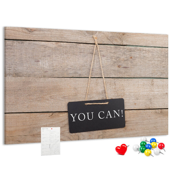 Kurk prikbord met een motiverend motief op een houten achtergrond