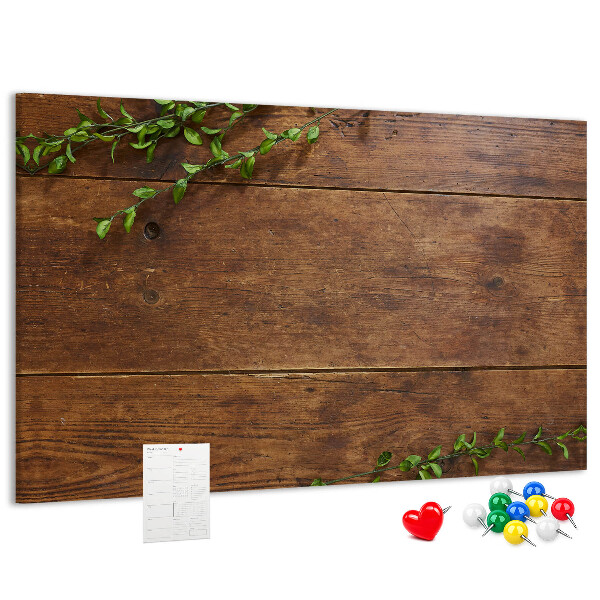 Prikbord natuurlijk hout met groene takken
