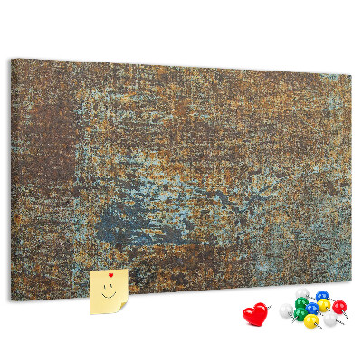 Prikbord met roestig oppervlak en blauwe accenten