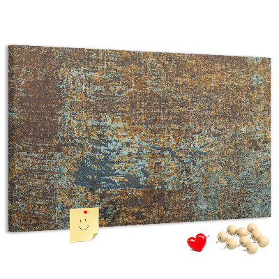 Prikbord met roestig oppervlak en blauwe accenten
