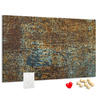 Prikbord met roestig oppervlak en blauwe accenten