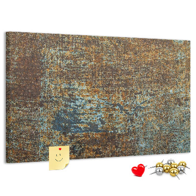 Prikbord met roestig oppervlak en blauwe accenten