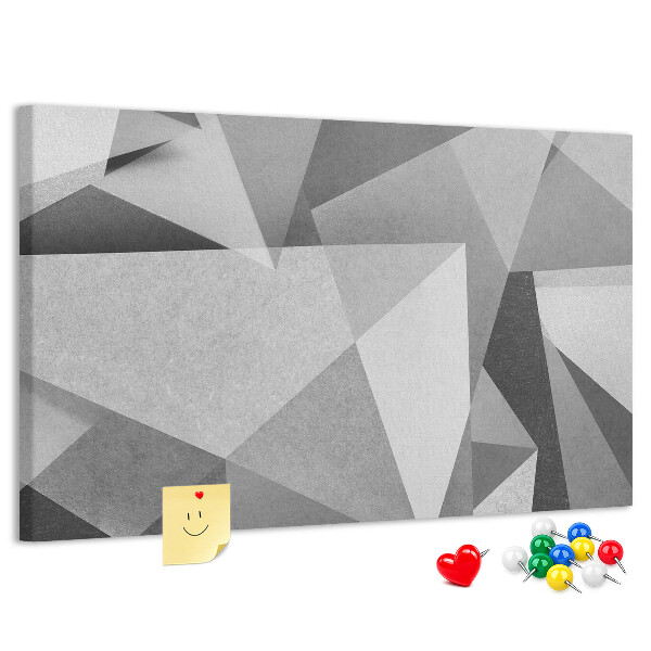 Prikbord met abstracte grijze en zwarte geometrische vormen