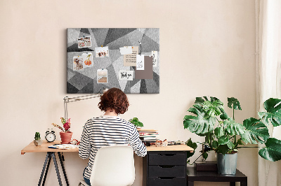 Prikbord met abstracte grijze en zwarte geometrische vormen