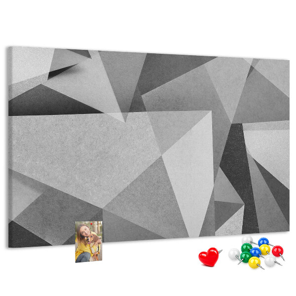 Prikbord met abstracte grijze en zwarte geometrische vormen