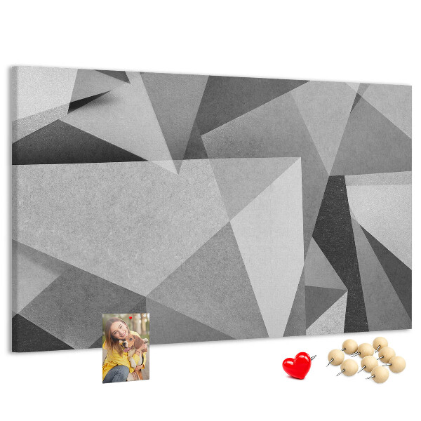 Prikbord met abstracte grijze en zwarte geometrische vormen