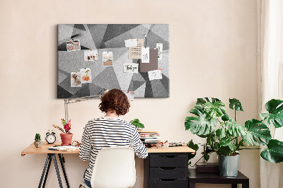 Prikbord met abstracte grijze en zwarte geometrische vormen