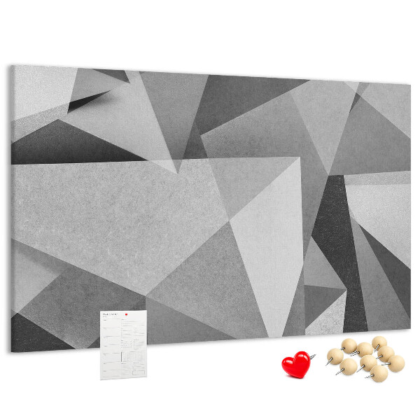 Prikbord met abstracte grijze en zwarte geometrische vormen