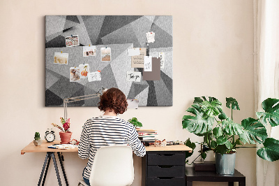 Prikbord met abstracte grijze en zwarte geometrische vormen