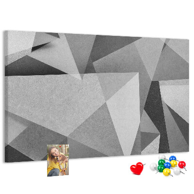 Prikbord met abstracte grijze en zwarte geometrische vormen