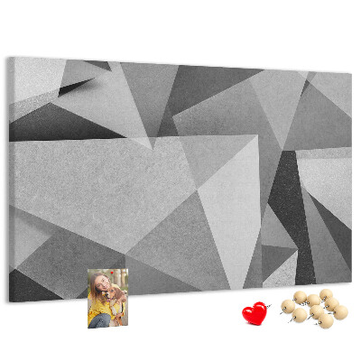 Prikbord met abstracte grijze en zwarte geometrische vormen