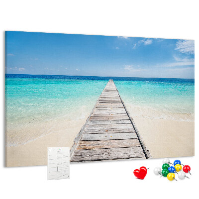 Prikbord met een rustige pier in een tropisch paradijs