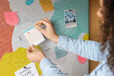 Prikbord met kleurrijke abstracte vormen en patronen