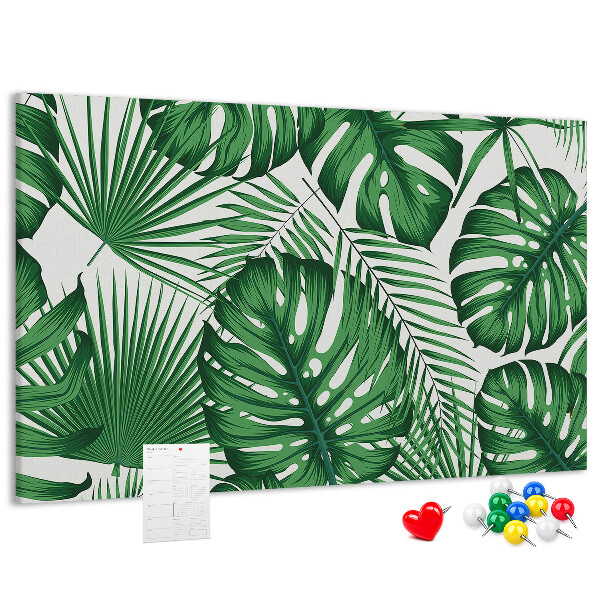Prikbord met talrijke bladeren van tropische planten in het groen