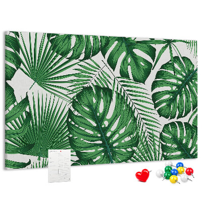 Prikbord met talrijke bladeren van tropische planten in het groen