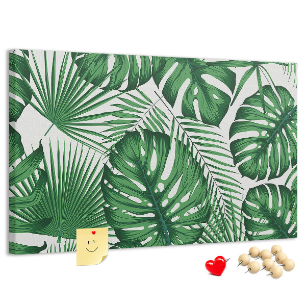 Prikbord met talrijke bladeren van tropische planten in het groen