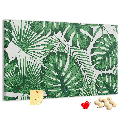 Prikbord met talrijke bladeren van tropische planten in het groen