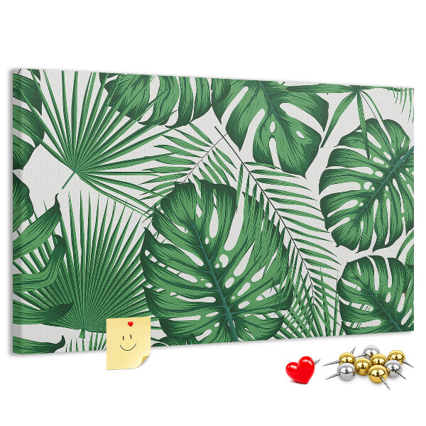 Prikbord met talrijke bladeren van tropische planten in het groen