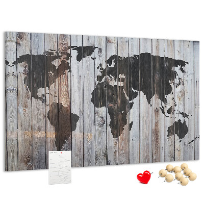 Prikbord wereldkaart op een achtergrond van houten planken