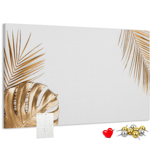 Prikbord met gouden bladeren op een witte achtergrond