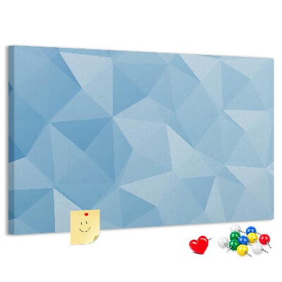 Prikbord met geometrische blauwe driehoeken in verschillende tinten
