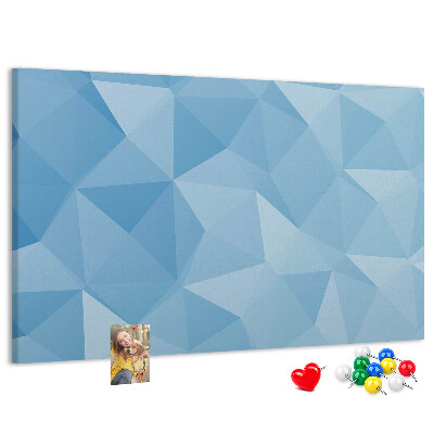 Prikbord met geometrische blauwe driehoeken in verschillende tinten