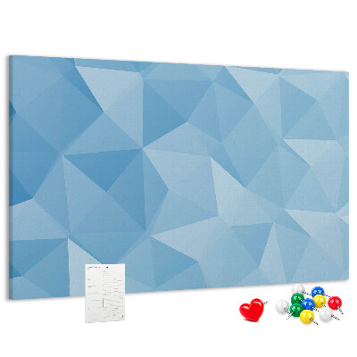 Prikbord met geometrische blauwe driehoeken in verschillende tinten