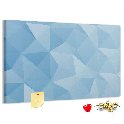 Prikbord met geometrische blauwe driehoeken in verschillende tinten