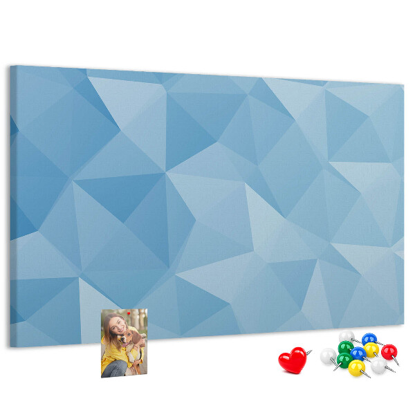 Prikbord met geometrische blauwe driehoeken in verschillende tinten