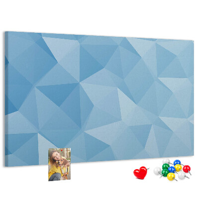 Prikbord met geometrische blauwe driehoeken in verschillende tinten