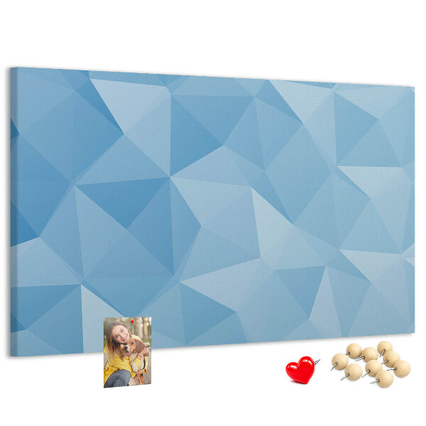 Prikbord met geometrische blauwe driehoeken in verschillende tinten