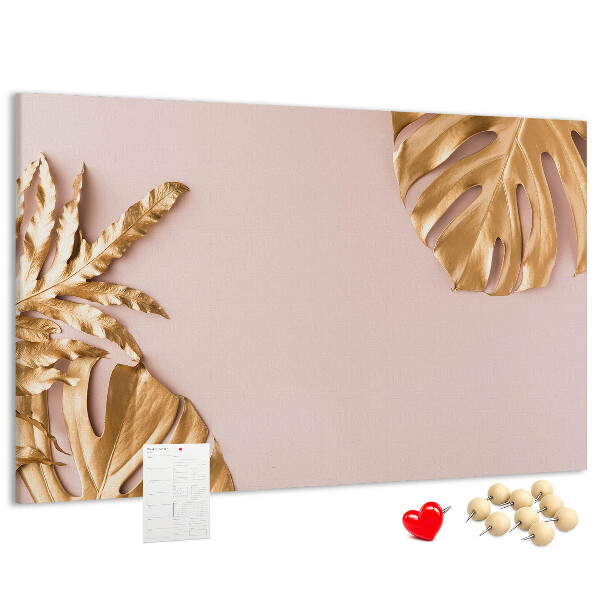 Prikbord met gouden bladeren op een delicate achtergrond